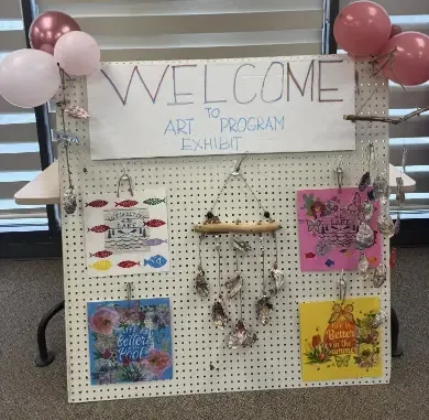 Hand-made welcome board at the entrance of the Resourceful Futures Art Program Exhibit
