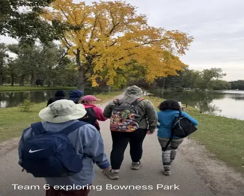 Clients walking the pathway together at Bowness Park in autumn