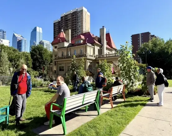 Clients and staff relaxing in a Calgary heritage house garden