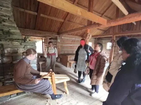Clients and staff watching a heritage trades demonstration at Heritage Park